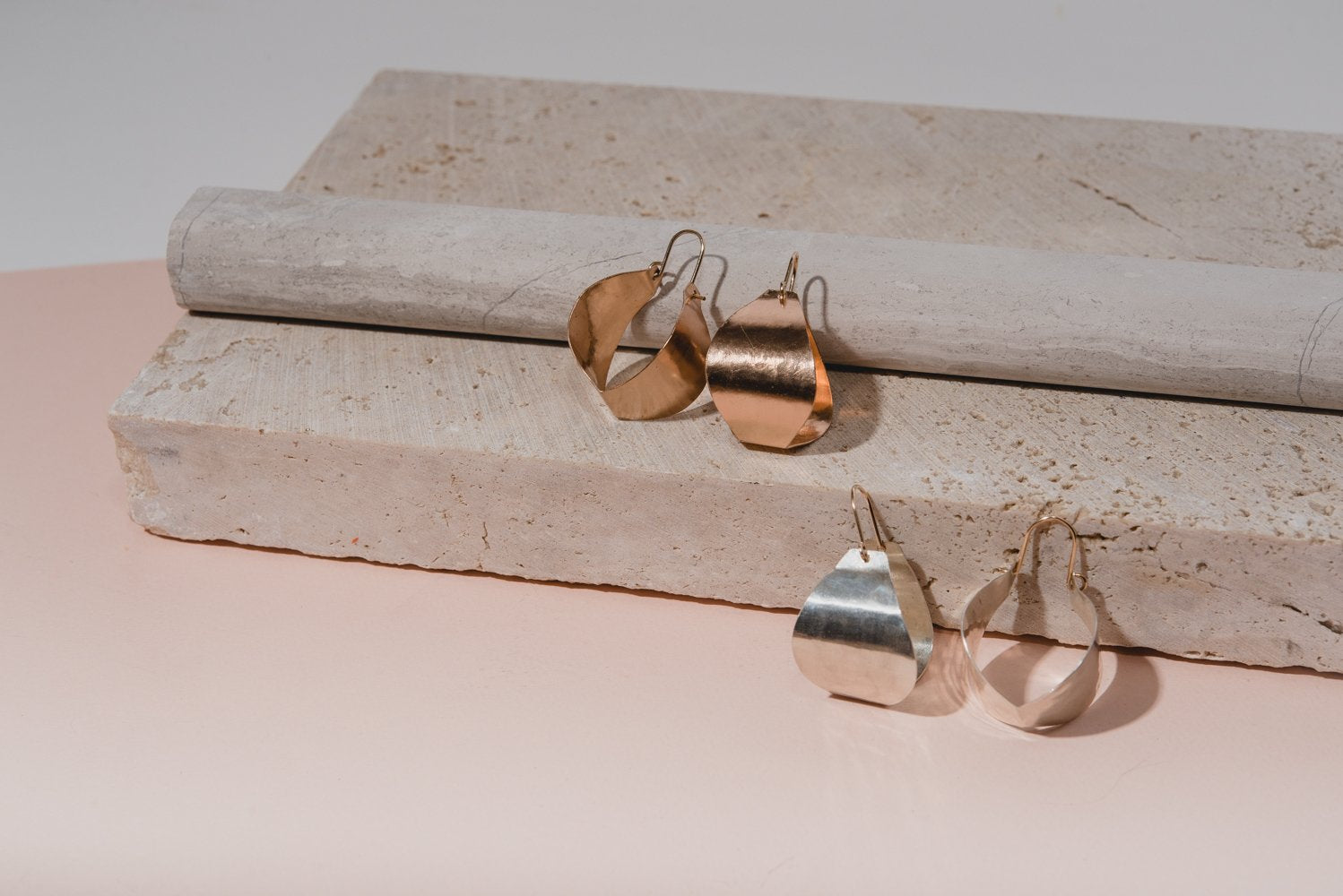 | small fluid bastet hoop | bold yet lightweight, the Fluid Bastet Hoop earring provides a striking and unique alternative to the traditional hoop; with hand-cut and hammered sheet and 14K yellow gold-fill ear wires, these hoops feature a modern design and mixed metal elements for a versatile sophistication | available in bronze or sterling silver | #failjewelry