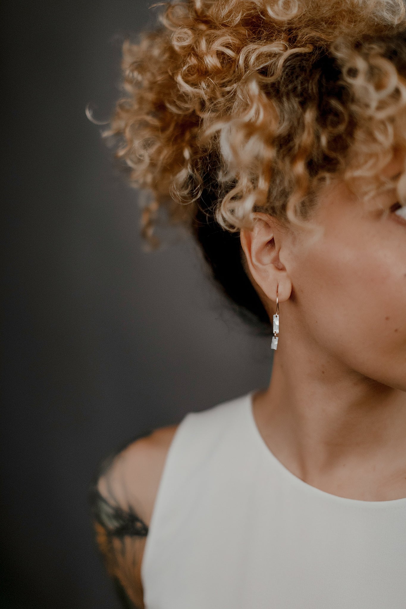 Small but dynamic, the Barra Earrings are a member of our Sorda collection and elevate any look with texture and movement. A heavier gauge wire is forged with a more exaggerated texture to catch the light.   Available in oxidized brass, sterling silver, or 14k gold fill, all with 14k gold fill details. 1 3/8" long.