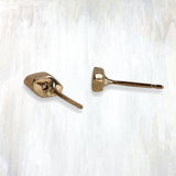 EPIC | slope studs | the chic Slope studs feature a single 0.08 tcw diamond flush set in a lightly textured gold diamond-shaped stud; available in 14K yellow or rose gold, 14K white gold upon request; 7 x 4 mm | #failjewelry