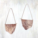 | fluid moon hoop | make a statement with the flowing, organic shape of the Fluid Moon Hoop earring; hand-cut and hammered sheet is suspended from long, triangular ear wires | available in bronze or sterling silver with 14K yellow gold-fill ear wires | #failjewelry