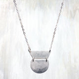 | corte necklace | a sleek geometric necklace featuring a hammered pendant comprised of semi circles and trapezoids | available in 14K gold fill and sterling silver | #failjewelry