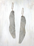 | femme earring | modern and bold, the Femme earring offers a reflective, lightweight elegance; hammered sheet creates an organic shape for each ear, symmetrical to each other, suspended from gold-fill wire; available in bronze or sterling silver | #failjewelry