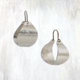 | small fluid bastet hoop | bold yet lightweight, the Fluid Bastet Hoop earring provides a striking and unique alternative to the traditional hoop; with hand-cut and hammered sheet and 14K yellow gold-fill ear wires, these hoops feature a modern design and mixed metal elements for a versatile sophistication | available in bronze or sterling silver | #failjewelry