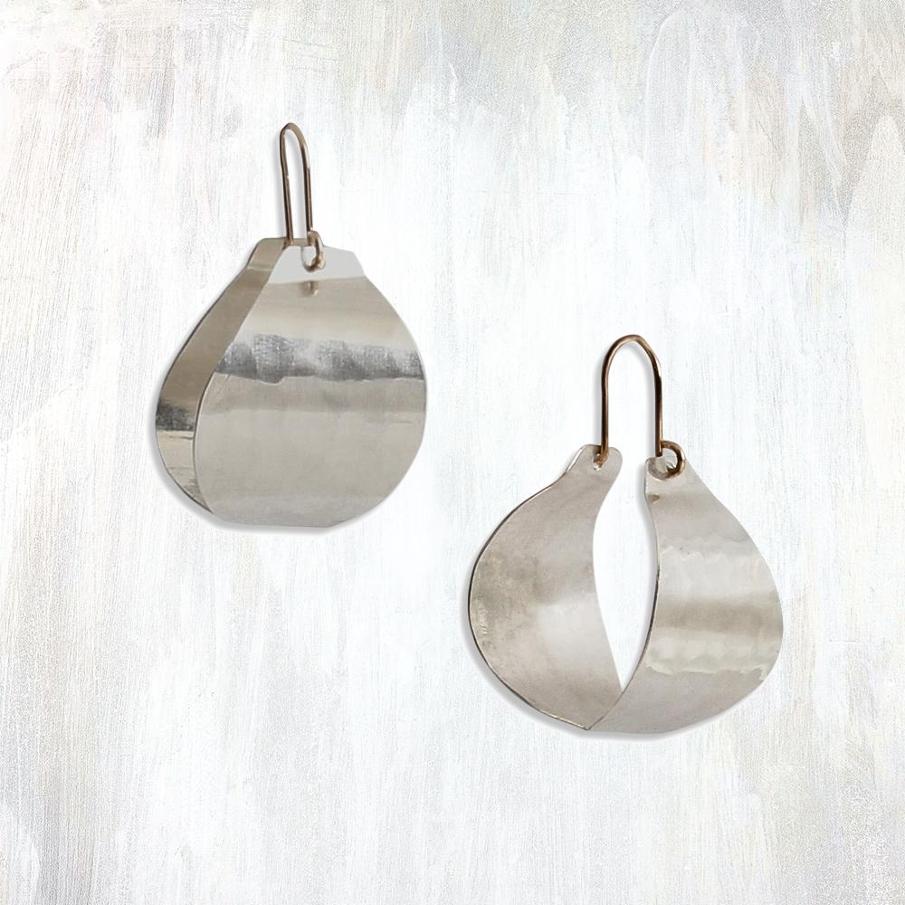 | small fluid bastet hoop | bold yet lightweight, the Fluid Bastet Hoop earring provides a striking and unique alternative to the traditional hoop; with hand-cut and hammered sheet and 14K yellow gold-fill ear wires, these hoops feature a modern design and mixed metal elements for a versatile sophistication | available in bronze or sterling silver | #failjewelry